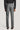 Grey mini houndstooth trouser with front pleats and back welt pockets, shown from behind.