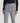 Light blue corduroy tailored trousers with side tabs and buckle closures at the waist.