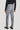 Light blue corduroy tailored trouser with side tabs, shown from back view on model wearing dark sweater.