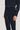 Navy corduroy tailored trousers with side tab waistband detail and vertical ribbed texture.
