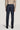Dark blue wool tailored trousers with side tabs and back welt pockets, shown from behind.