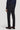 Navy solid stretch trouser with flat front and button closure, shown on model wearing dark brown leather shoes.