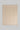 Cream-colored blanket with repeating chevron pattern in tan, bordered with whipstitching on all edges.