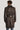 Taupe trench coat with notch collar, shoulder epaulettes, belted waist, and rolled cuffs, shown from back view on model.