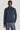Man wearing navy washed quarter-zip pullover with long sleeves and ribbed cuffs.