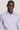 Lavender button-up dress shirt with spread collar and white buttons on male model.