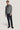 Charcoal ribbed cardigan with shawl collar and button front, worn over black shirt and navy pants.