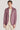 Man wearing mauve melange blazer with notch lapels, two-button front, and chest pocket over cream t-shirt.